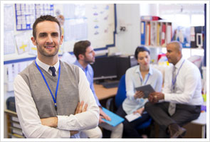 tutor smiling in front other academics